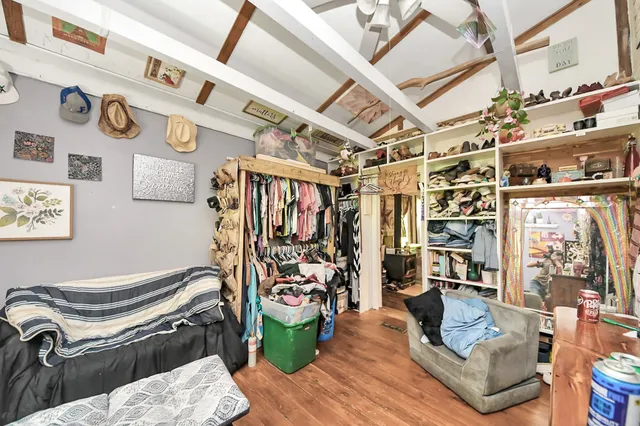 a view of a livingroom with furniture and workspace