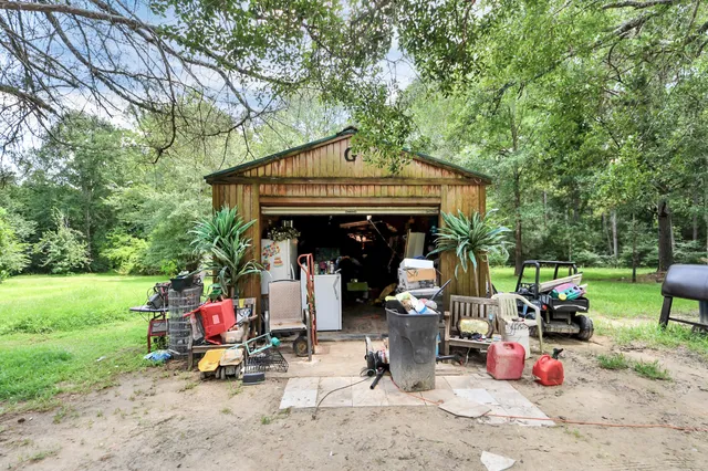 a view of a small car is parked in front of a house