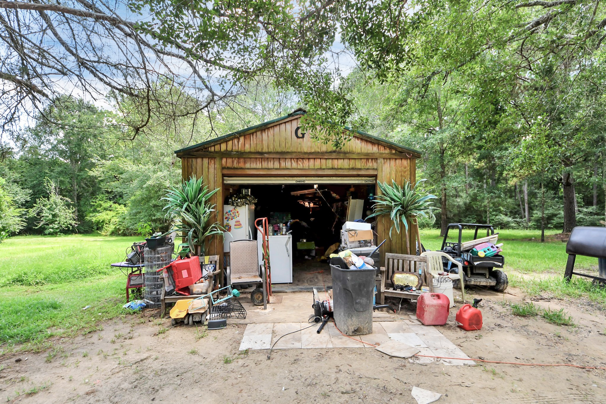 101 Rocky Road Livingston, TX 77351 - Photo 30 of 42 a view of a small car is parked in front of a house