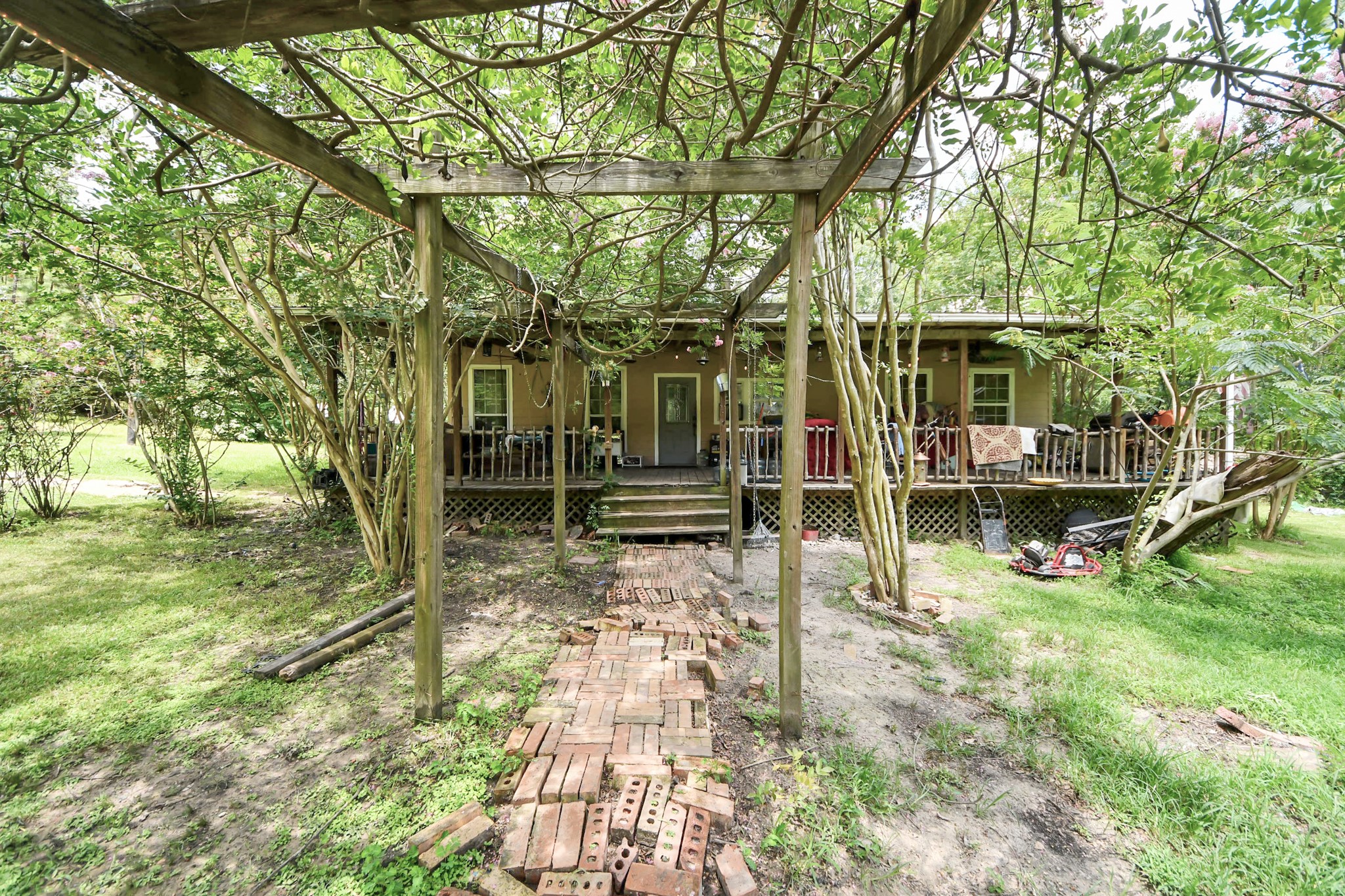 101 Rocky Road Livingston, TX 77351 - Photo 33 of 42 a view of a yard with wooden fence