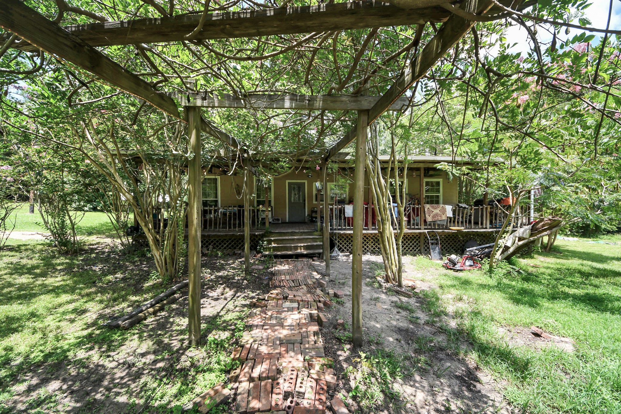 101 Rocky Road Livingston, TX 77351 - Photo 35 of 42 a backyard of a house with lots of green space