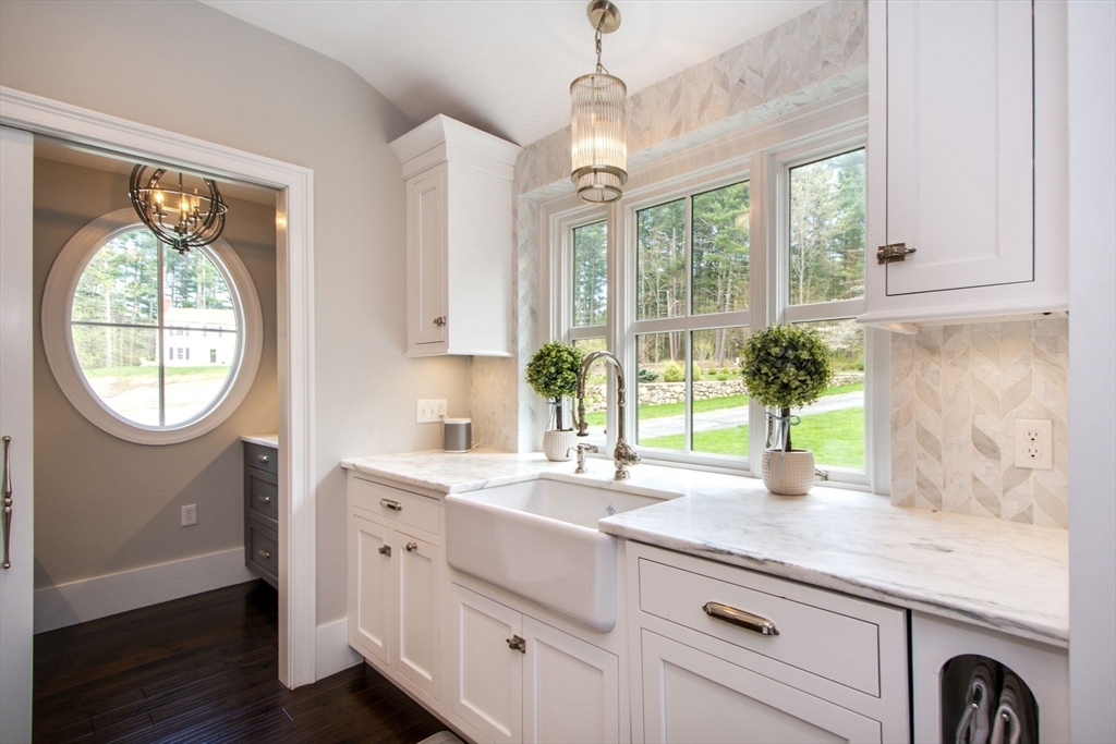 41 Brigantine Circle Norwell, MA 02061 - Photo 11 of 37 a kitchen with a sink and a large window