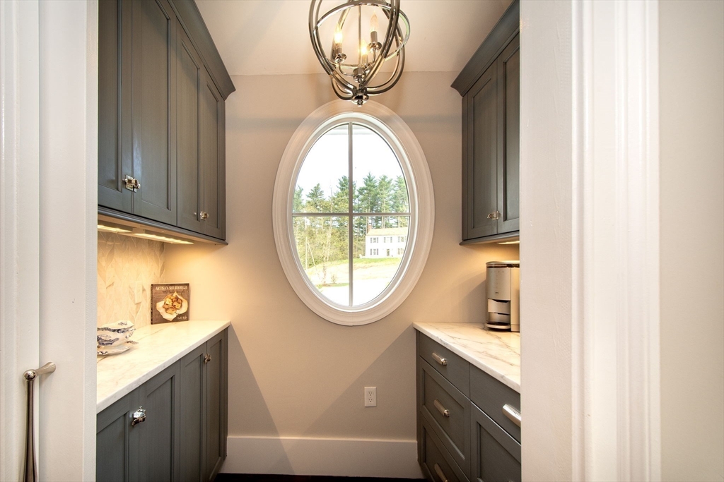41 Brigantine Circle Norwell, MA 02061 - Photo 12 of 37 a bathroom with a toilet a sink and a mirror