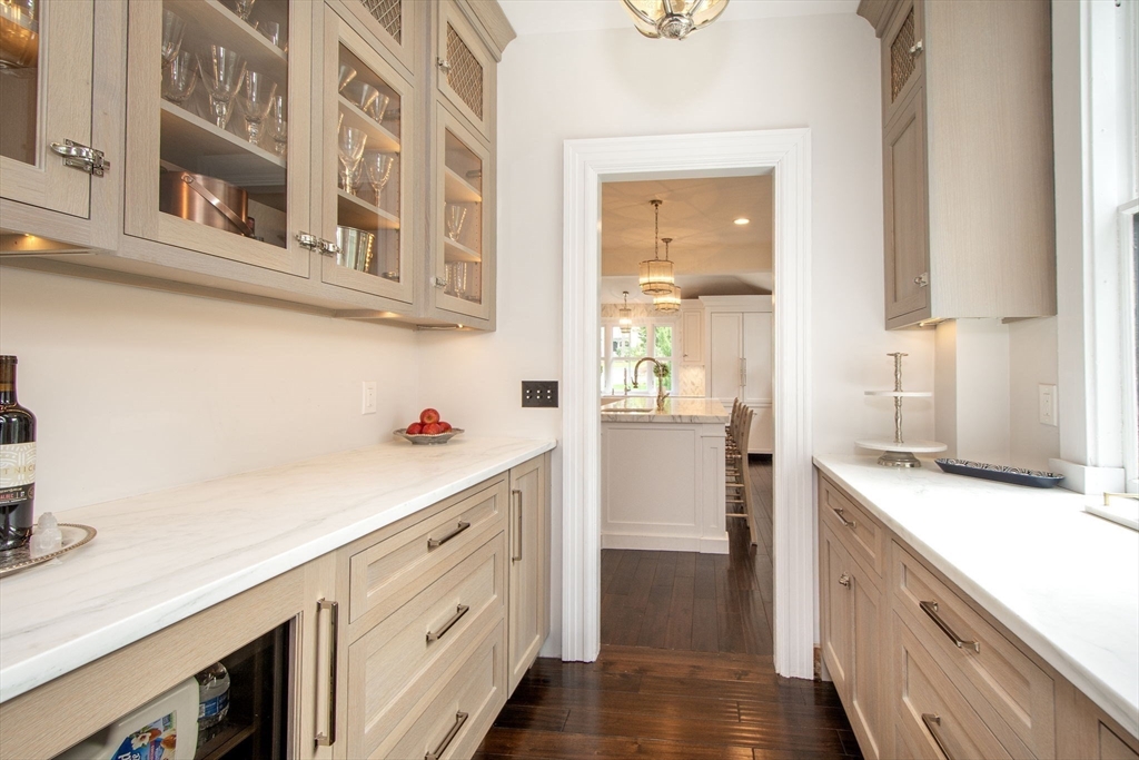 41 Brigantine Circle Norwell, MA 02061 - Photo 13 of 37 a kitchen with white cabinets and white appliances