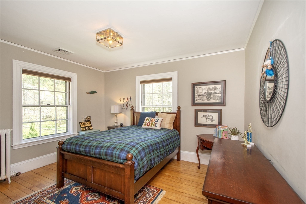 41 Brigantine Circle Norwell, MA 02061 - Photo 25 of 37 a bedroom with a bed a dresser and next to a window