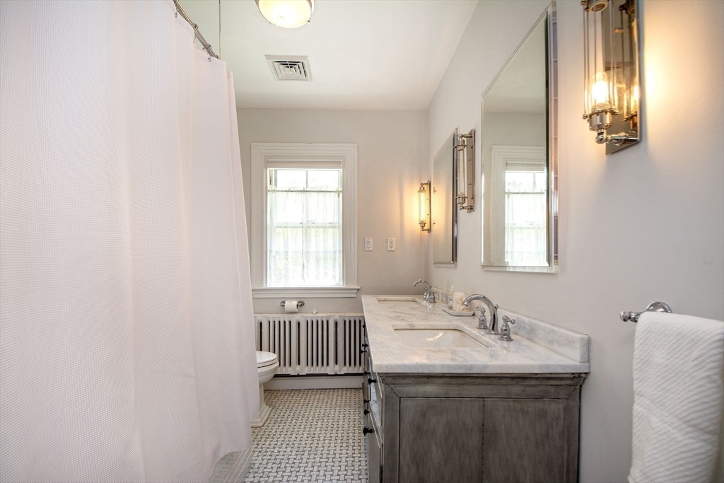 41 Brigantine Circle Norwell, MA 02061 - Photo 26 of 37 a bathroom with a sink and a mirror