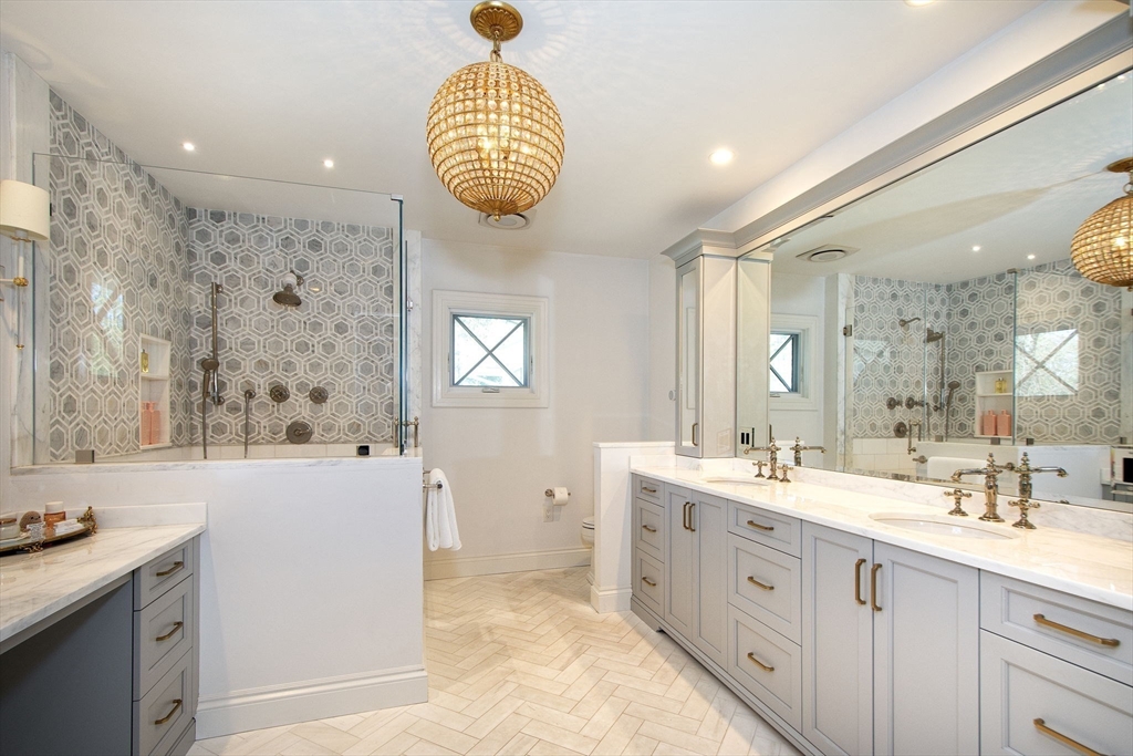 41 Brigantine Circle Norwell, MA 02061 - Photo 29 of 37 a spacious bathroom with a double vanity sink a mirror and a bathtub