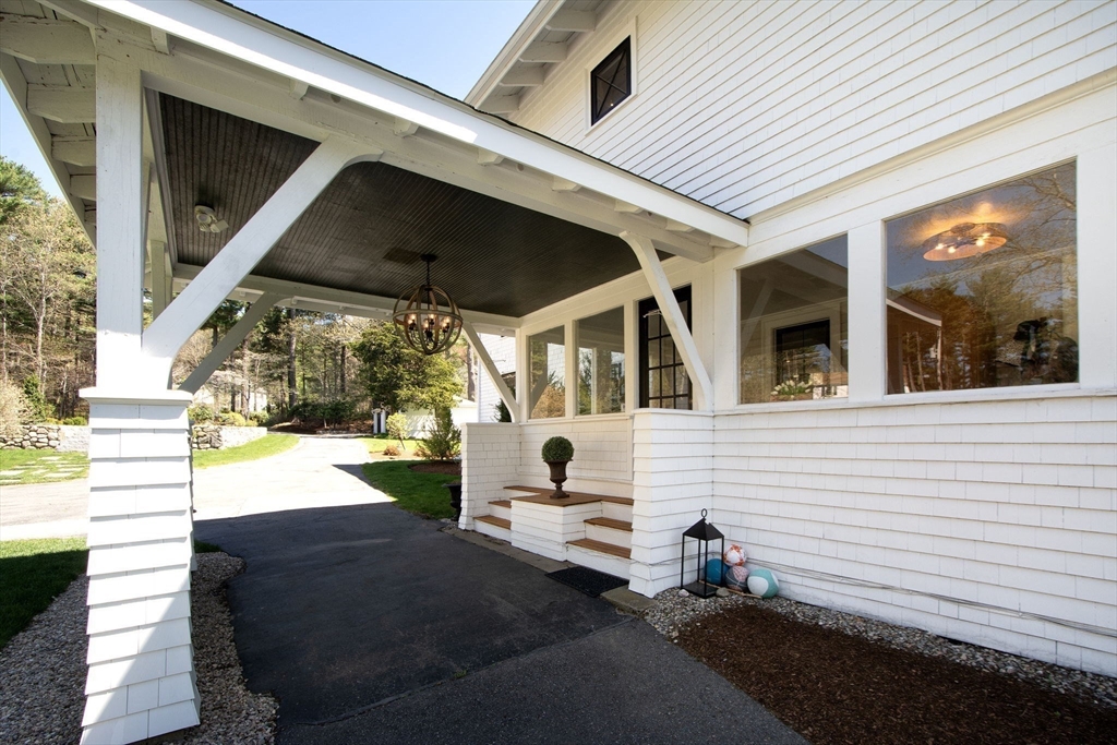 41 Brigantine Circle Norwell, MA 02061 - Photo 31 of 37 a view of a patio with table and chairs with wooden floor and fence