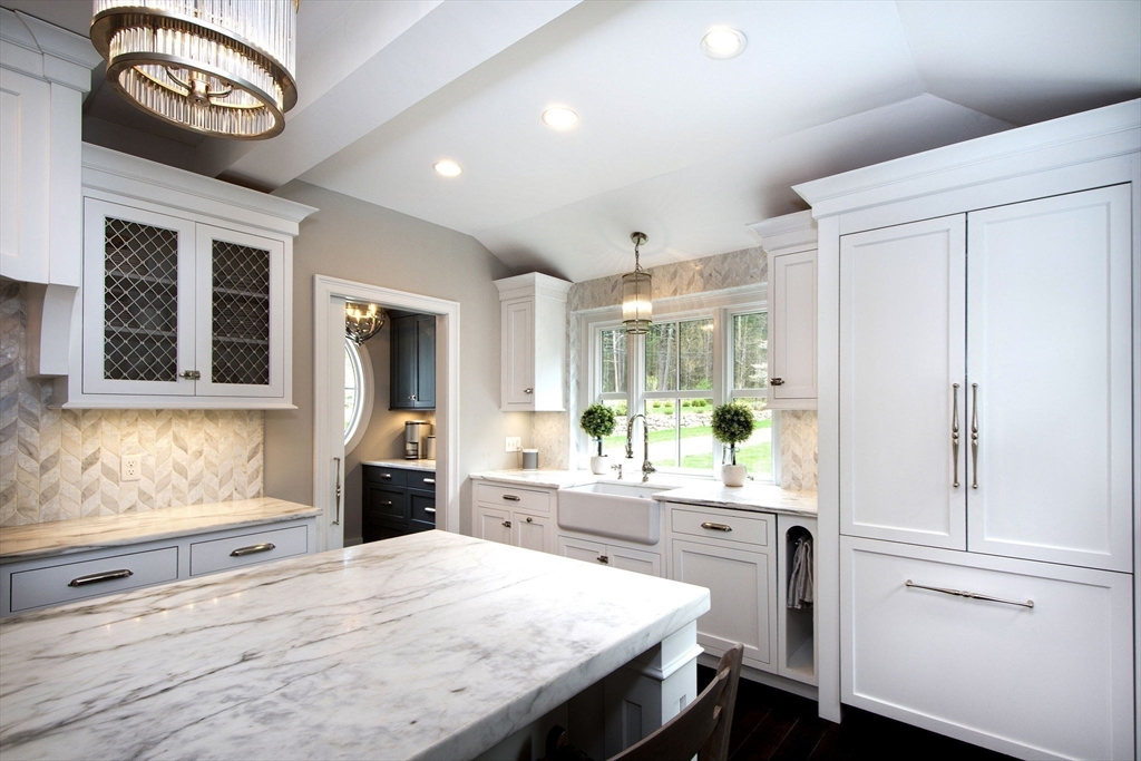 41 Brigantine Circle Norwell, MA 02061 - Photo 6 of 37 a kitchen with a stove a refrigerator and a view of living room