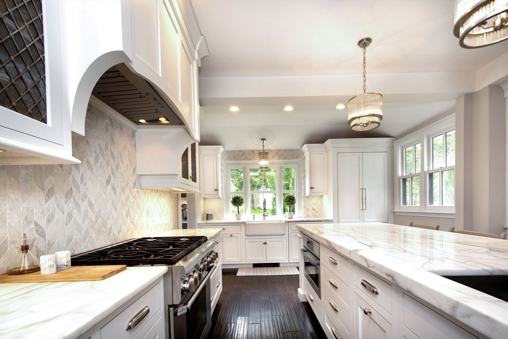 41 Brigantine Circle Norwell, MA 02061 - Photo 7 of 37 a kitchen with a sink stove and cabinets