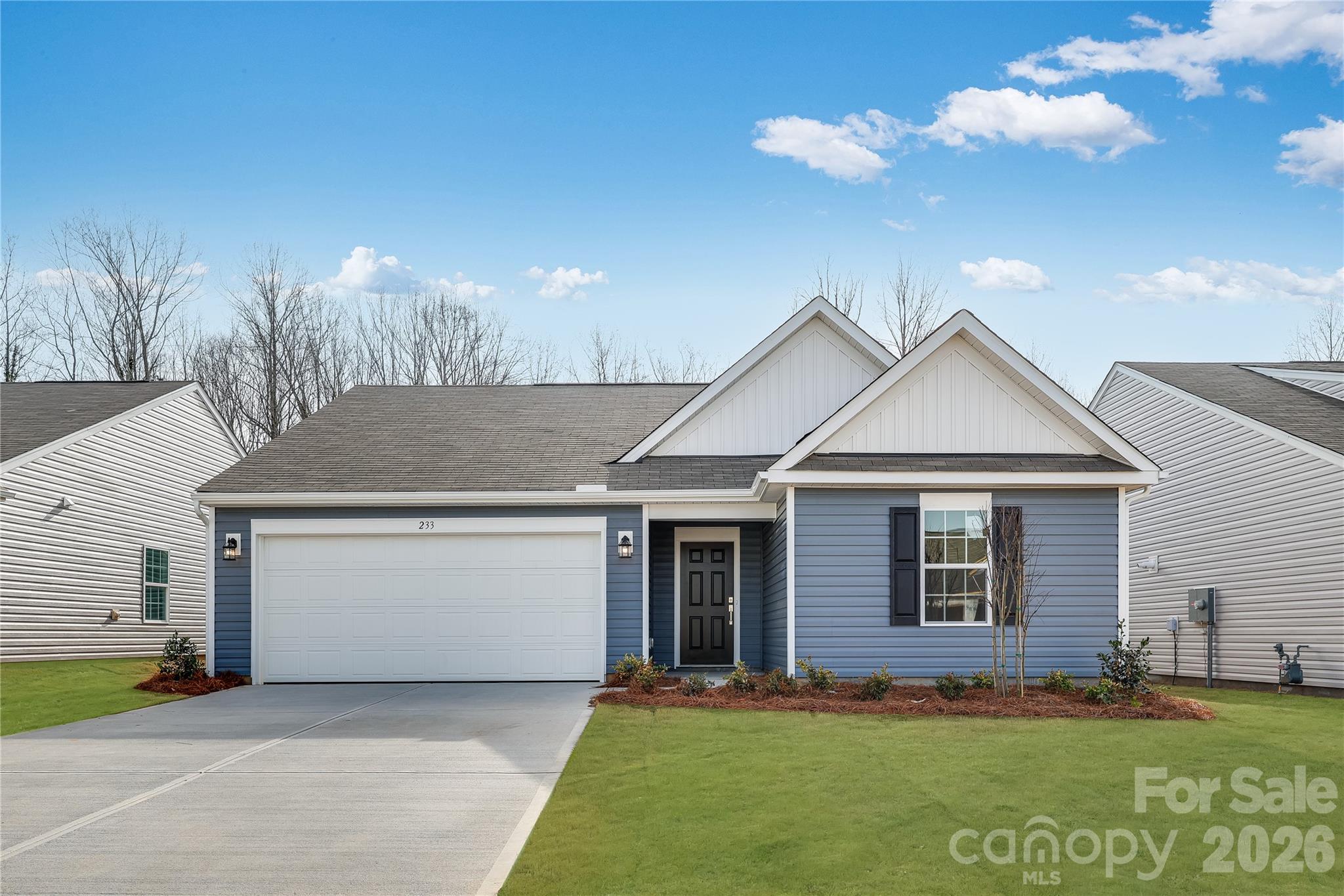 233 West 18th Street Kannapolis, NC 28081 - Photo 1 of 27 a front view of a house with a yard and garage