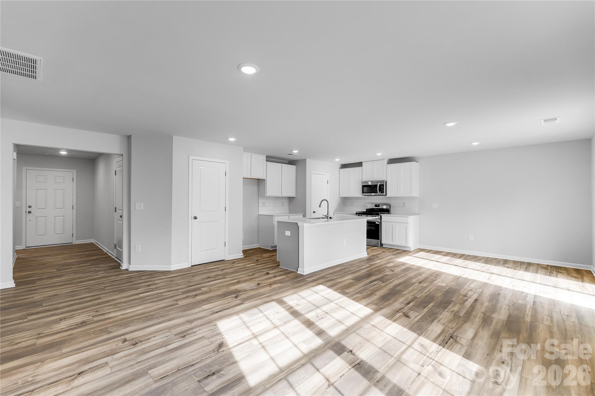 233 West 18th Street Kannapolis, NC 28081 - Photo 16 of 27 a view of kitchen with wooden floor