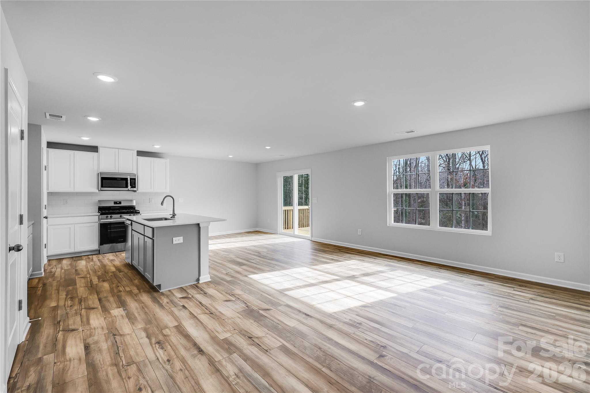 233 West 18th Street Kannapolis, NC 28081 - Photo 17 of 27 a view of kitchen with wooden floor and electronic appliances