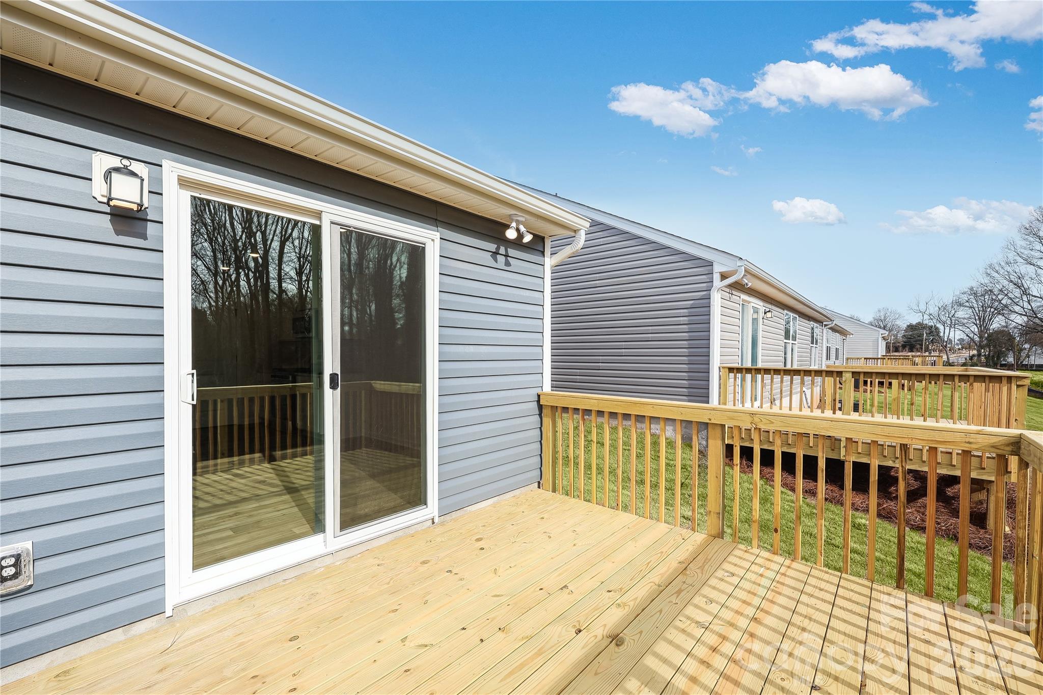 233 West 18th Street Kannapolis, NC 28081 - Photo 2 of 27 a view of a balcony with wooden floor