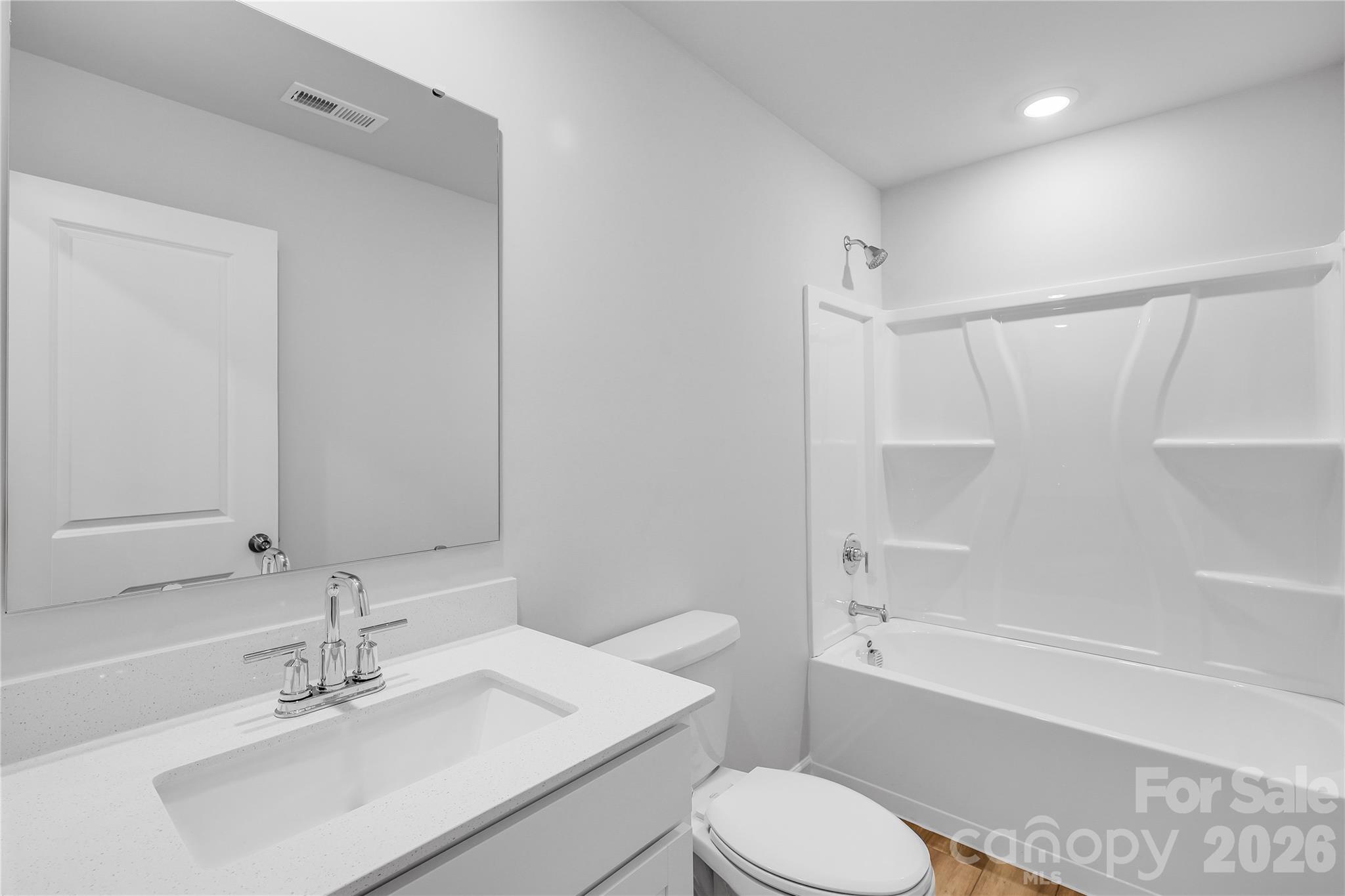 233 West 18th Street Kannapolis, NC 28081 - Photo 21 of 27 a bathroom with a sink toilet and shower