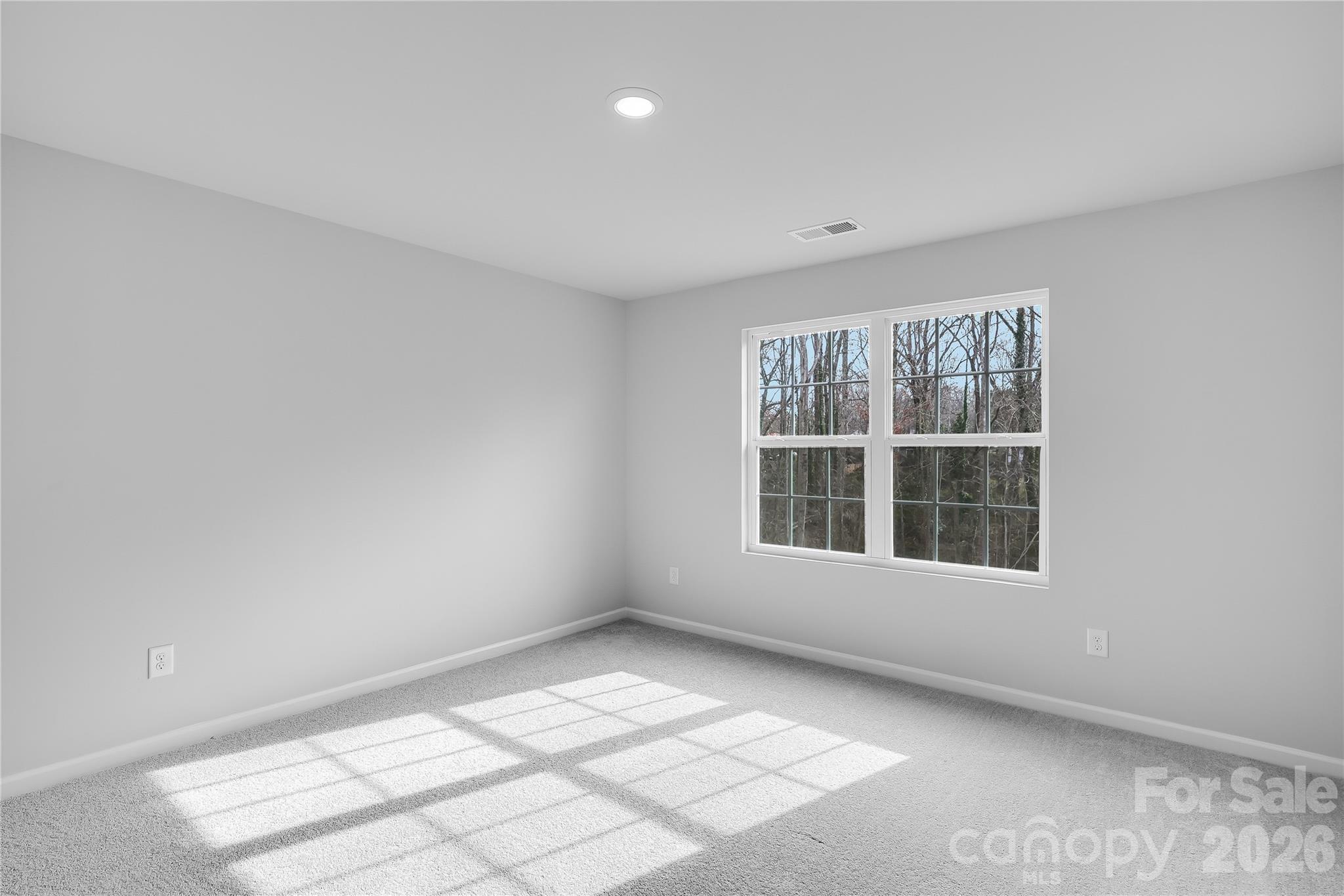 233 West 18th Street Kannapolis, NC 28081 - Photo 4 of 27 an empty room with windows