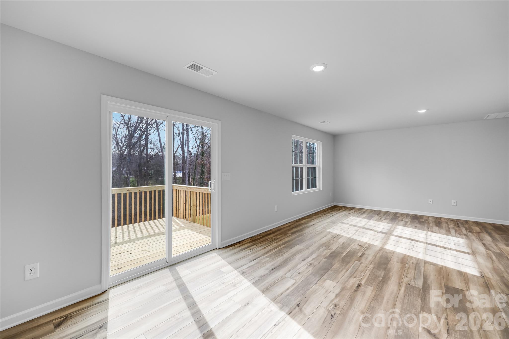 233 West 18th Street Kannapolis, NC 28081 - Photo 6 of 27 a view of an empty room with a window