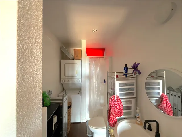 a living room with furniture and flowers