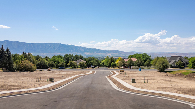 1473 Red Fox Court, Unit 4 Logan, UT 84321 - Photo 12 of 19 Developed residential street with paved roadway and concrete sidewalks