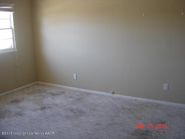 5121 Bowie Street Amarillo, TX 79110 - Photo 9 of 13 an empty room with a window