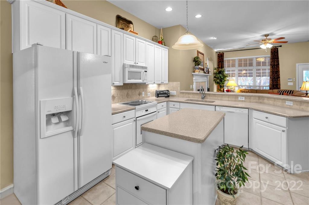 17018 Carlton Way Road Huntersville, NC 28078 - Photo 21 of 42 a kitchen with white cabinets and white appliances