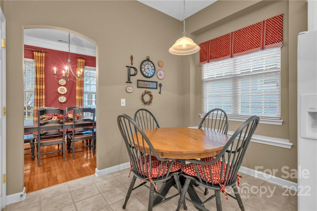 17018 Carlton Way Road Huntersville, NC 28078 - Photo 22 of 42 a dining room with furniture and wooden floor