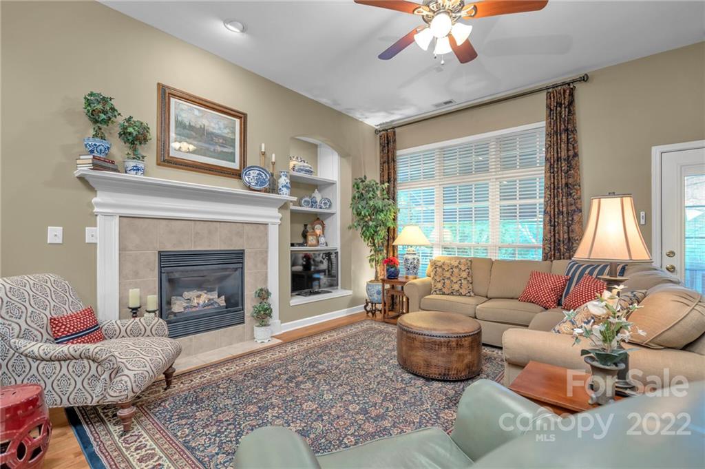 17018 Carlton Way Road Huntersville, NC 28078 - Photo 25 of 42 a living room with furniture and a fireplace