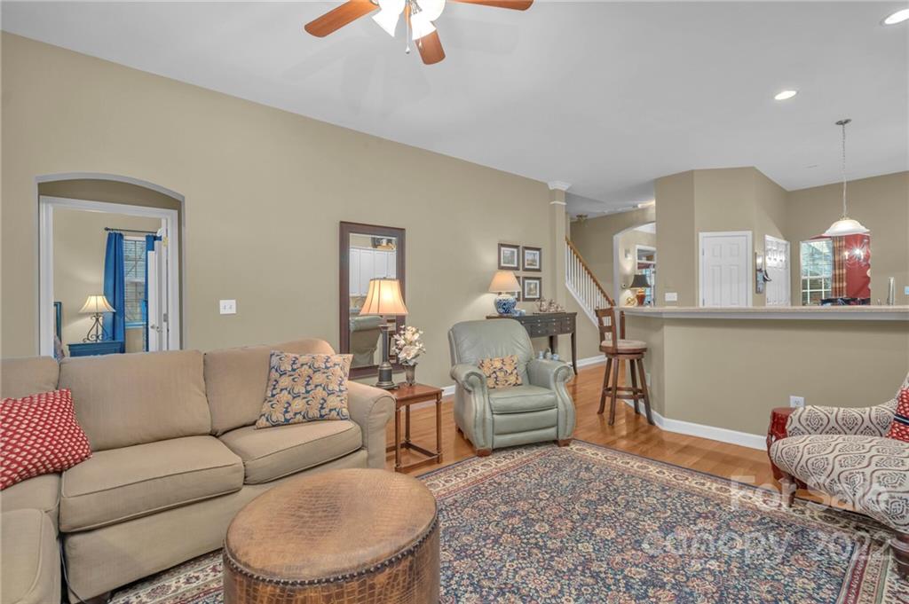 17018 Carlton Way Road Huntersville, NC 28078 - Photo 27 of 42 a living room with furniture a rug and white walls