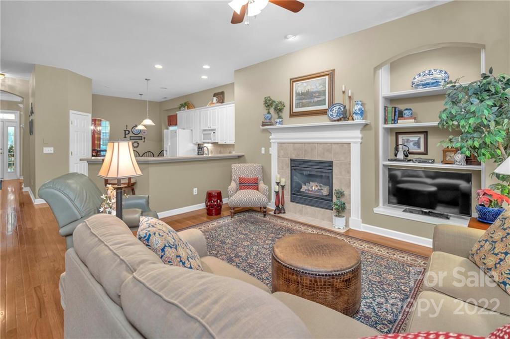 17018 Carlton Way Road Huntersville, NC 28078 - Photo 28 of 42 a living room with furniture and a fireplace