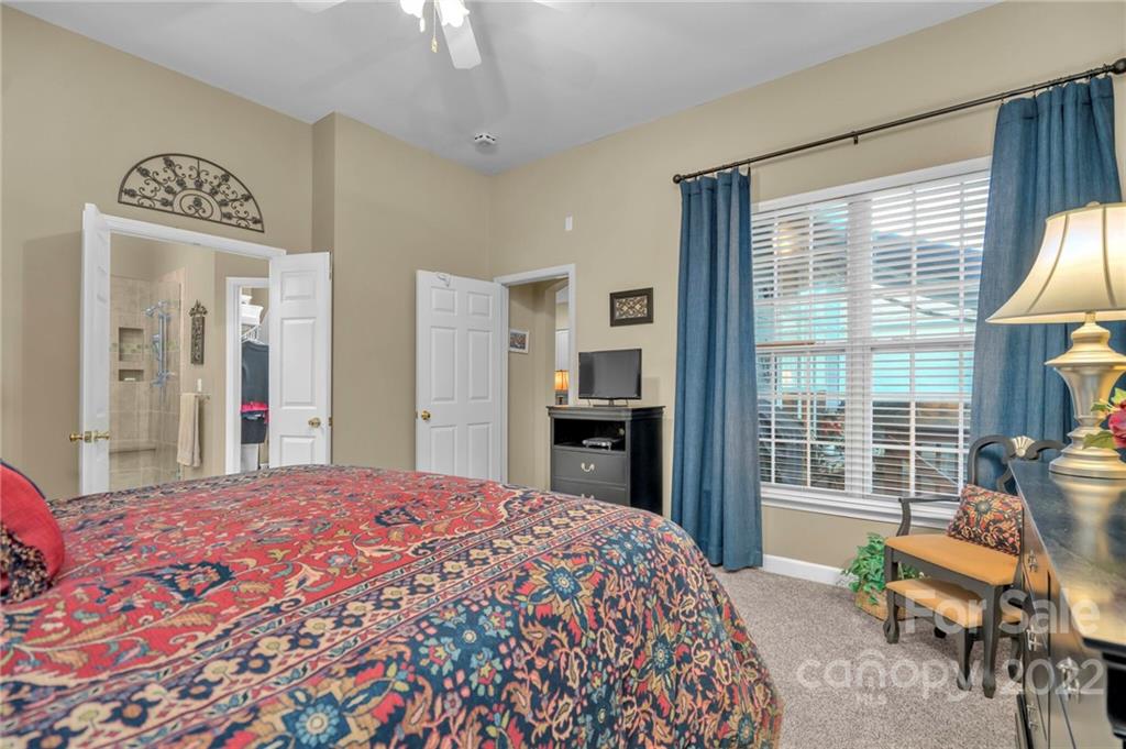 17018 Carlton Way Road Huntersville, NC 28078 - Photo 31 of 42 a bedroom with a bed and a large window