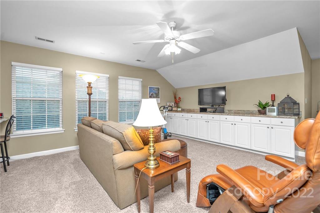 17018 Carlton Way Road Huntersville, NC 28078 - Photo 39 of 42 a living room with furniture and a large window