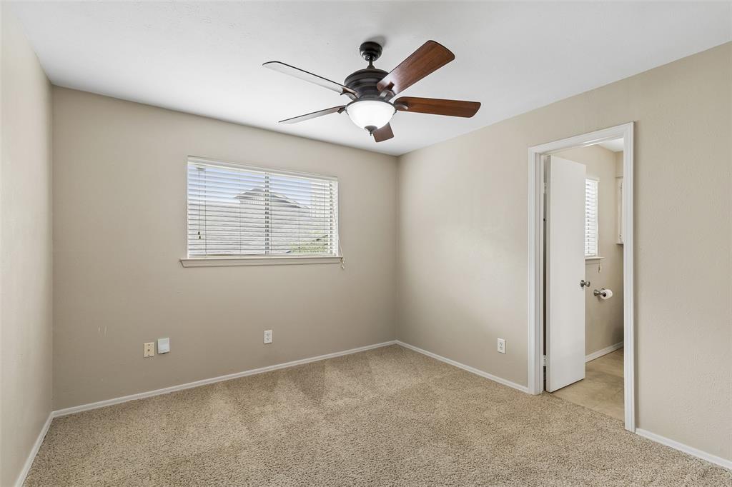 4962 Thunder Road Dallas, TX 75244 - Photo 21 of 26 The secondary bedrooms are split from the master and have an adjoining bath between the two bedrooms.
