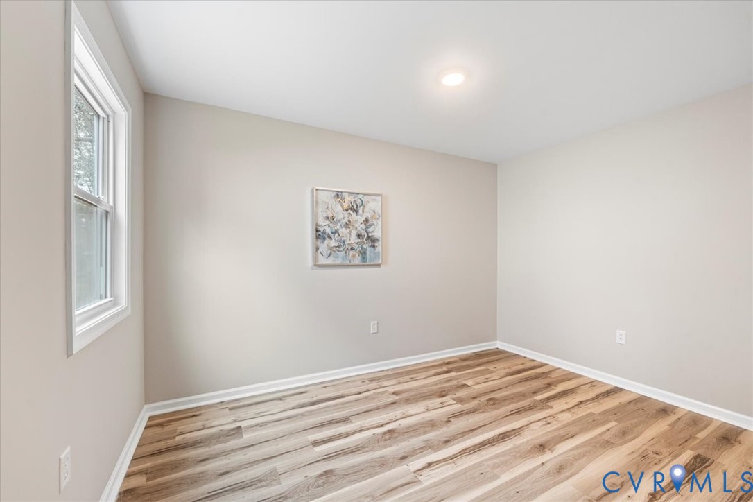 1989 Cox Road Blackstone, VA 23824 - Photo 20 of 44 Unfurnished room featuring light wood-style floors