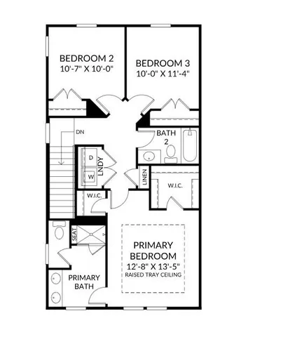 a front view of a building with a garden and trees