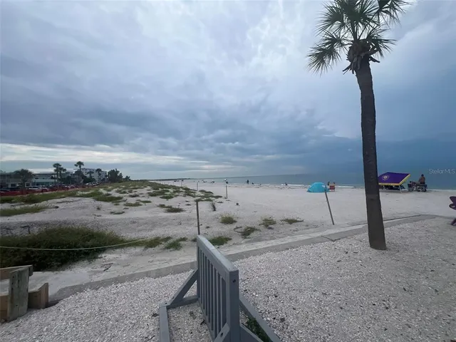 an aerial view of residential houses with outdoor space and river