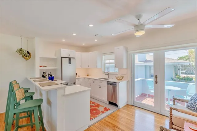 a view of balcony with a table and chairs