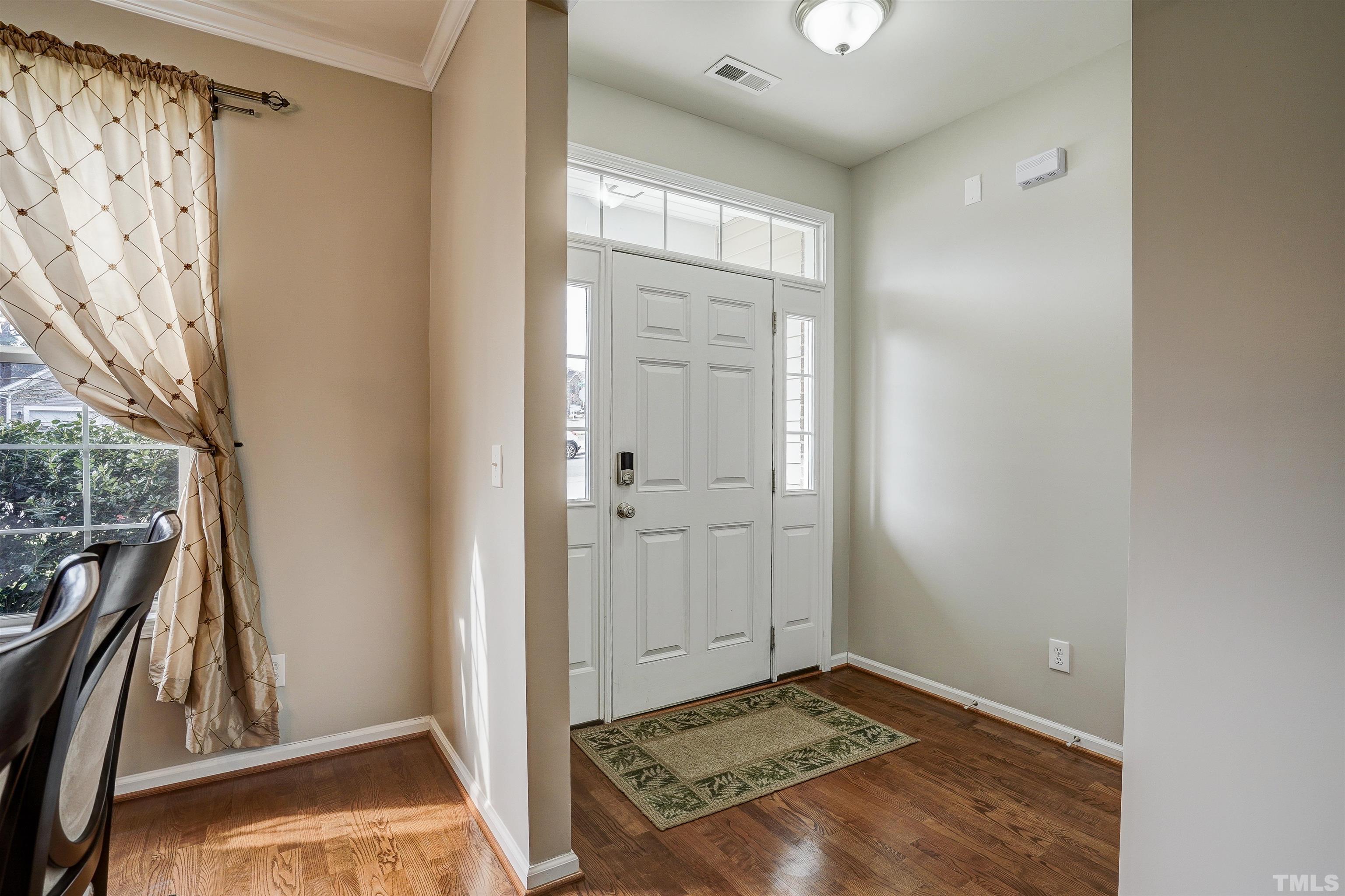 301 Cottesbrook Drive Wake Forest, NC 27587 - Photo 3 of 32 a view of an empty room and a window