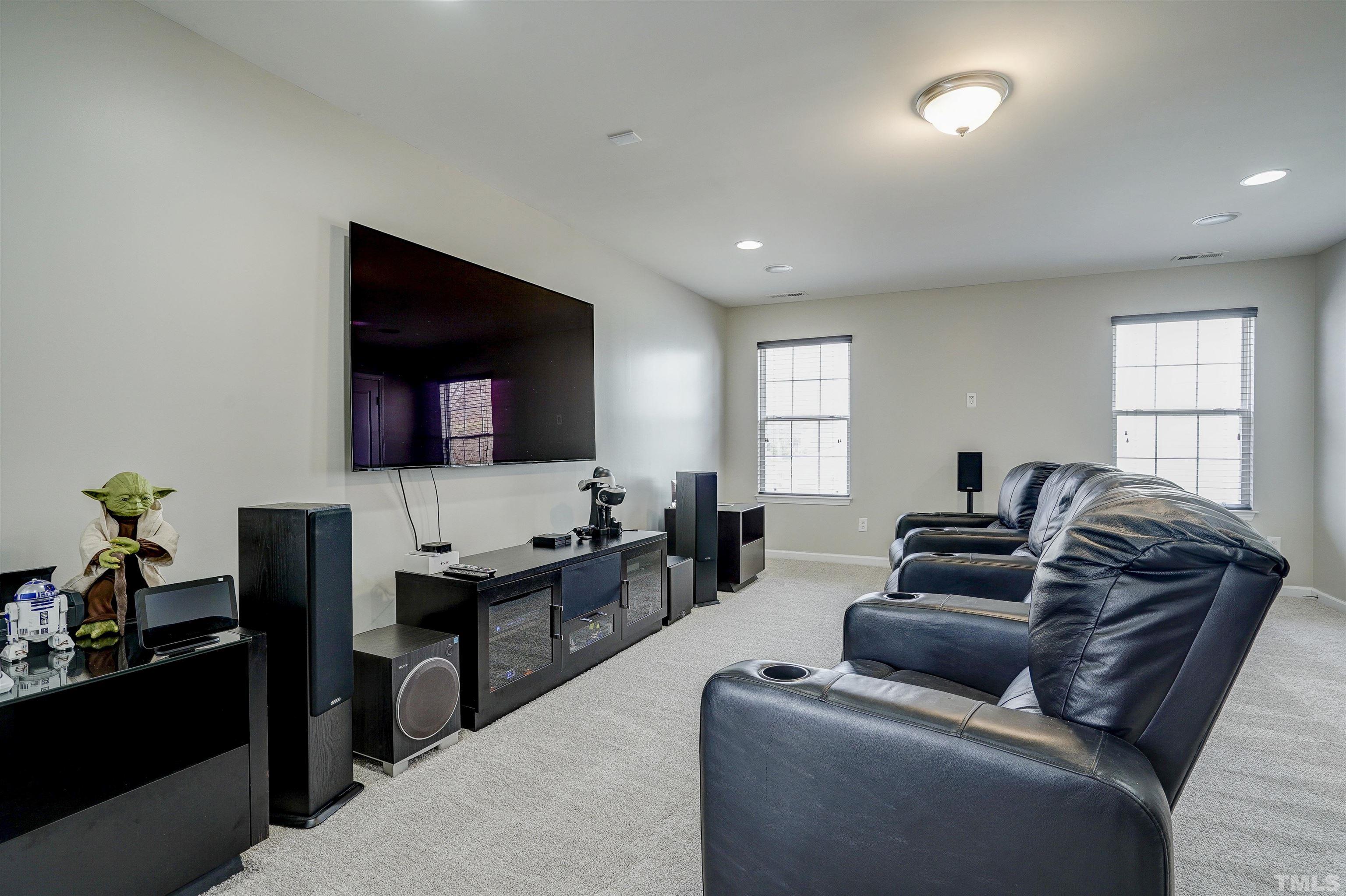 301 Cottesbrook Drive Wake Forest, NC 27587 - Photo 4 of 32 a living room with furniture and a flat screen tv