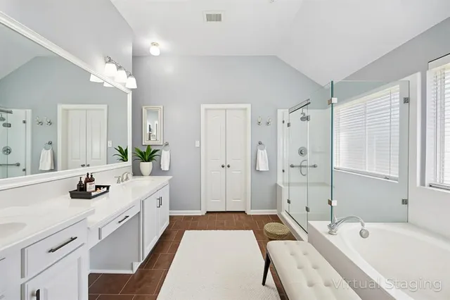 a bedroom with a bed couch and window