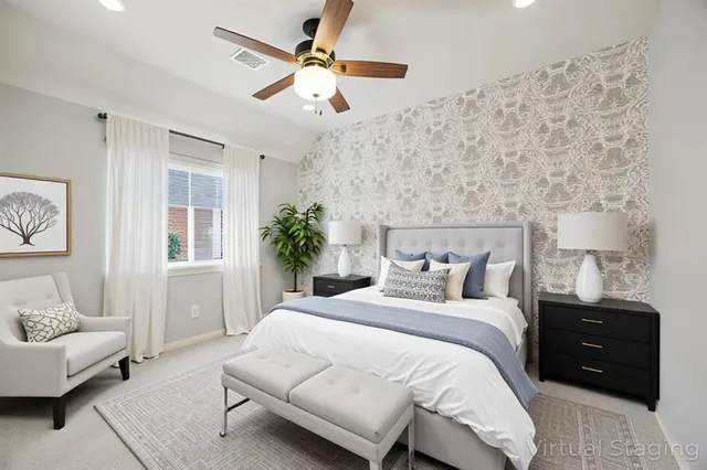 a bedroom with a bed and a chair