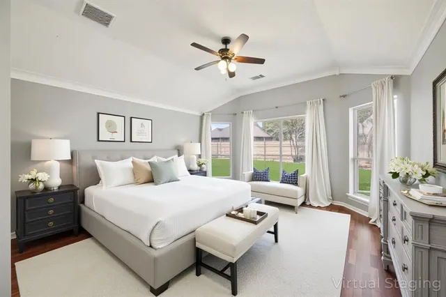 a spacious bathroom with a tub sink double vanity and mirror
