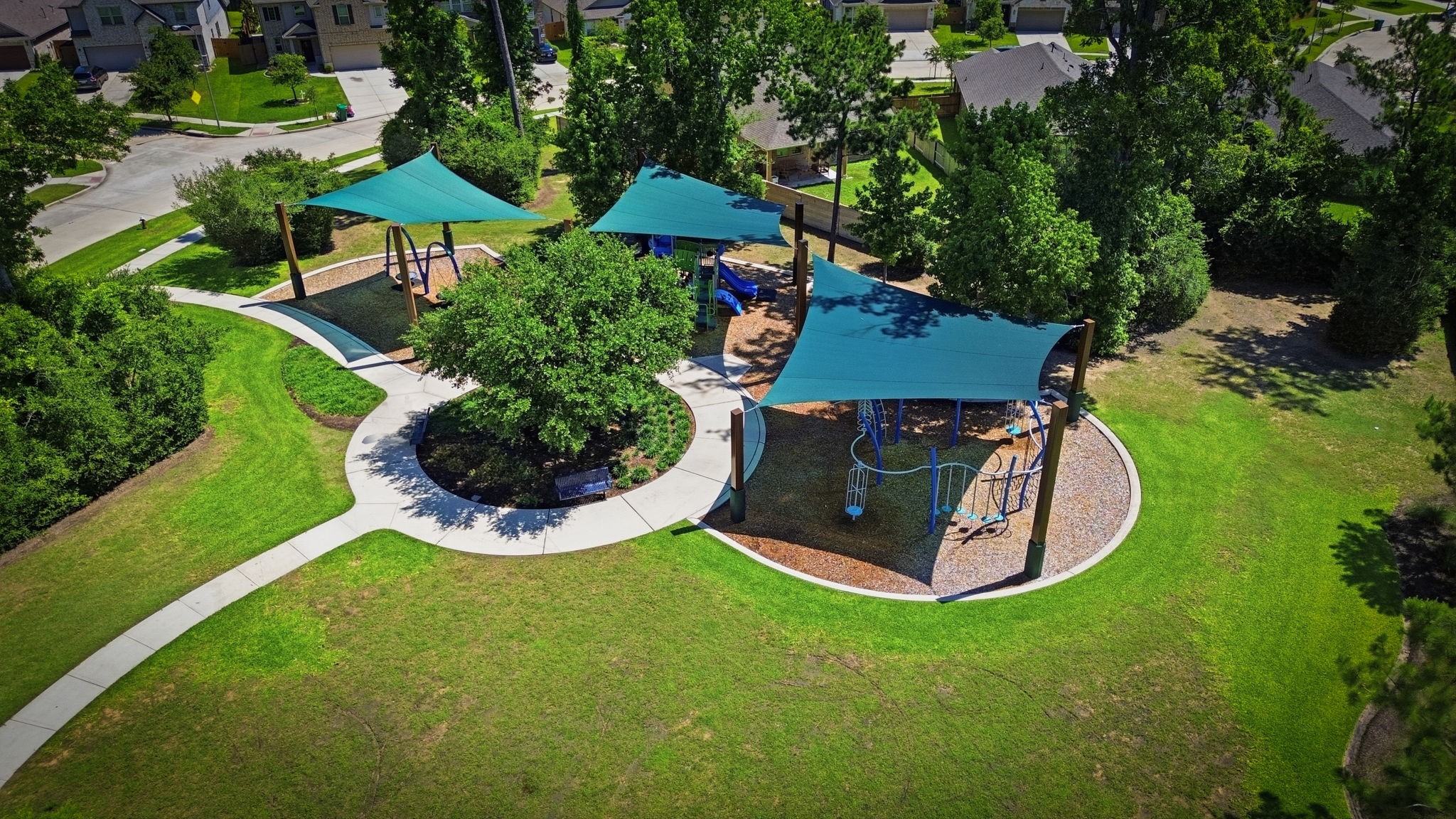4334 Umber Shadow Drive Spring, TX 77386 - Photo 43 of 45 Community park features a playground, shaded gathering areas, and expansive green space for outdoor enjoyment.
