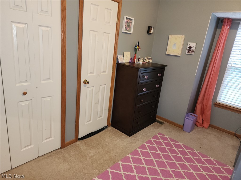 9890 Hoose Road Mentor, OH 44060 - Photo 18 of 30 Bedroom with light carpet