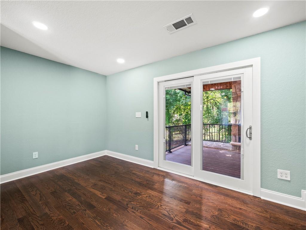 5209 Byers Road Gainesville, GA 30504 - Photo 12 of 34 an empty room with wooden floor and windows