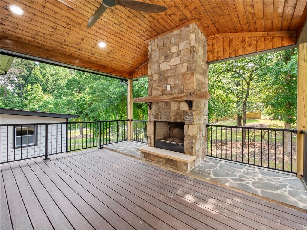 5209 Byers Road Gainesville, GA 30504 - Photo 15 of 34 a view of backyard with a balcony and wooden floor