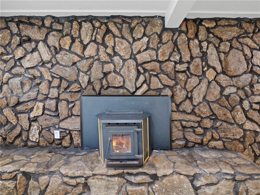 5209 Byers Road Gainesville, GA 30504 - Photo 17 of 34 a room with a fireplace and a table