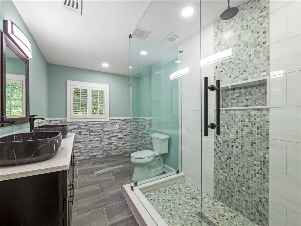 5209 Byers Road Gainesville, GA 30504 - Photo 24 of 34 a bathroom with a sink a toilet and shower