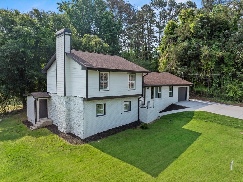 5209 Byers Road Gainesville, GA 30504 - Photo 32 of 34 a view of a house with a yard