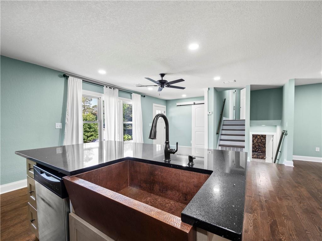 5209 Byers Road Gainesville, GA 30504 - Photo 7 of 34 a kitchen with a table chairs and a stove