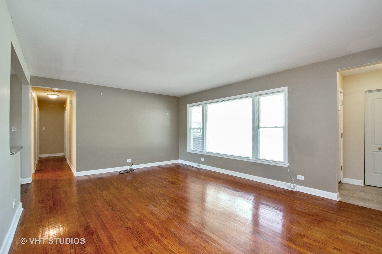 1008 Braemar Road Flossmoor, IL 60422 - Photo 2 of 10 a view of an empty room with wooden floor and a window